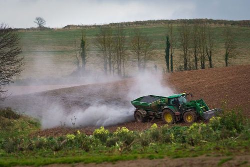 http://commons.wikimedia.org/wiki/File:Spreading\_lime\_on\_a\_Devon\_field.jpg